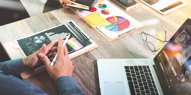Books on marketing with notepad